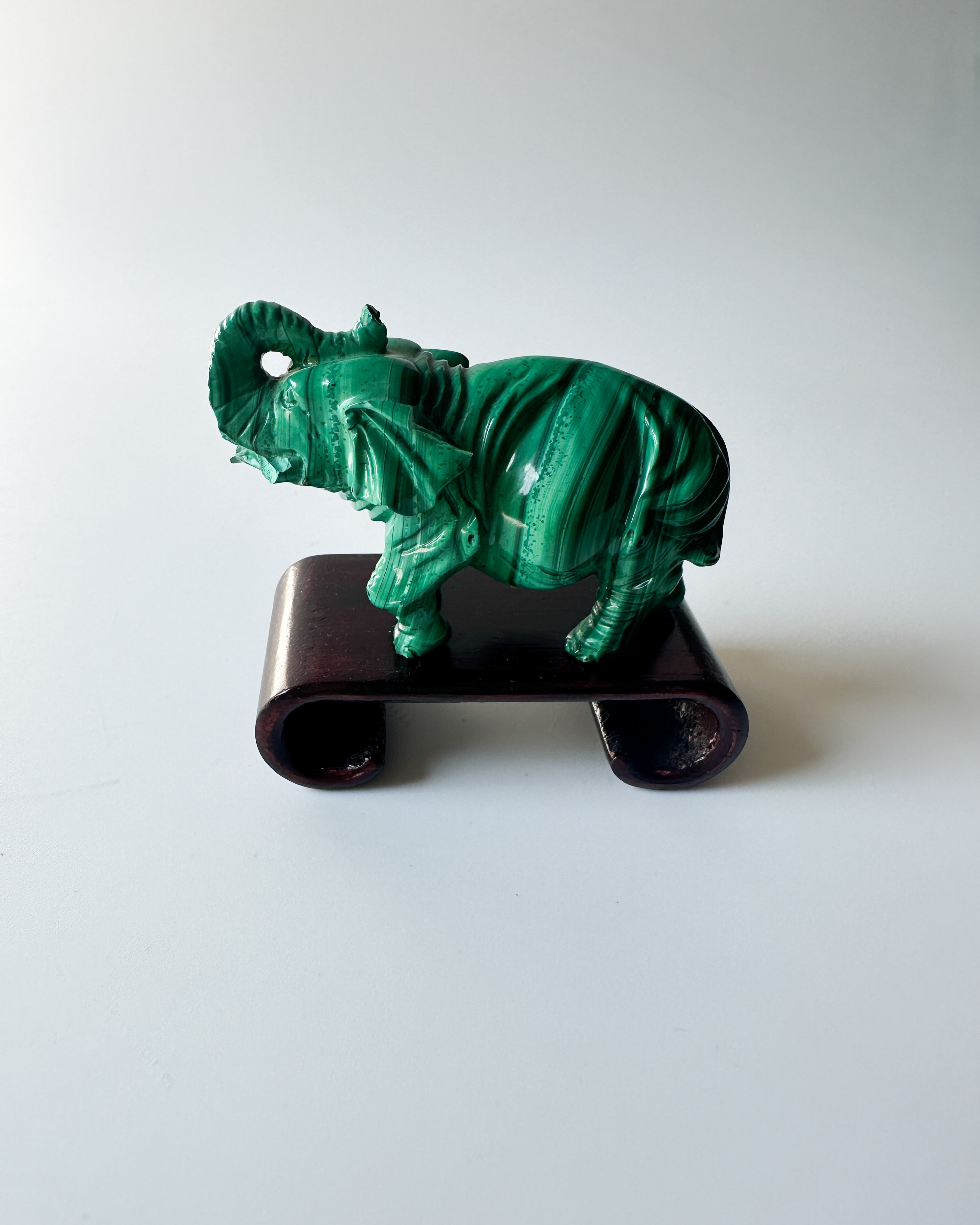 Genuine Malachite Elephant with Wood Stand (2.3125"L x 1"W x 1.75"H)